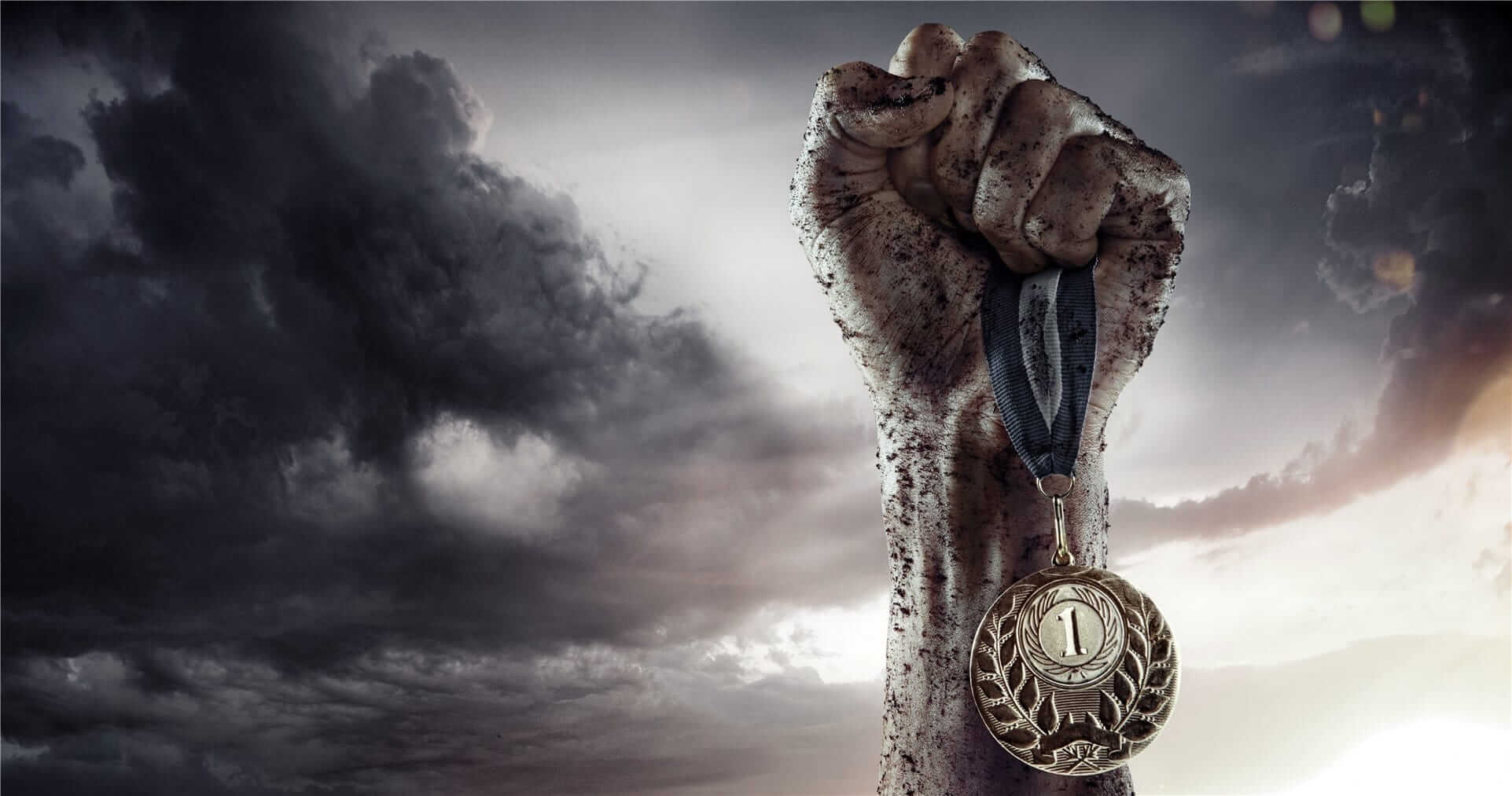 Sport a medal hold in a raised fist